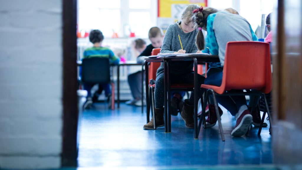 Children working at classroom desks